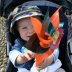 Boy in a buggy with a windmill