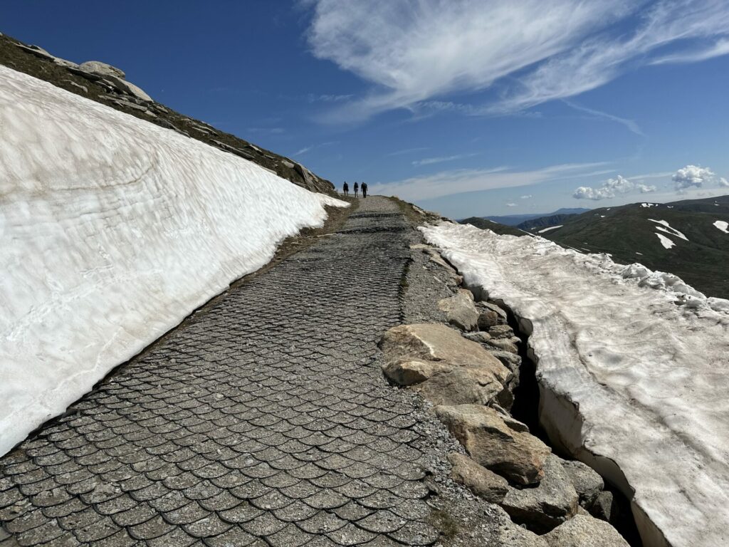 A path with snow to one side
