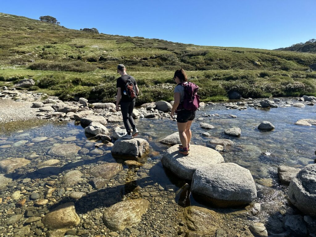 My companions crossing a stream